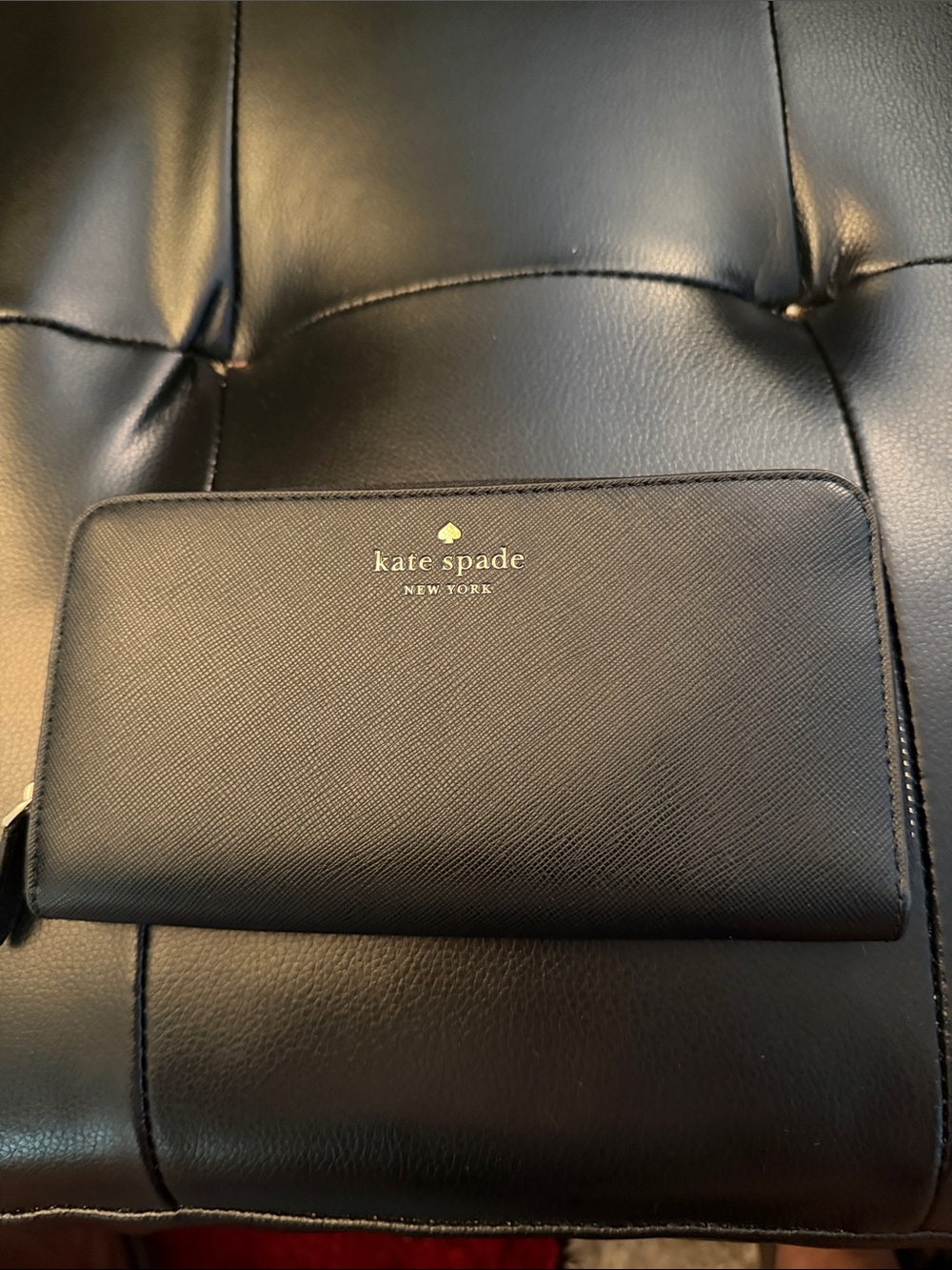 kate spade black Saffiano zip-around wallet with gold logo